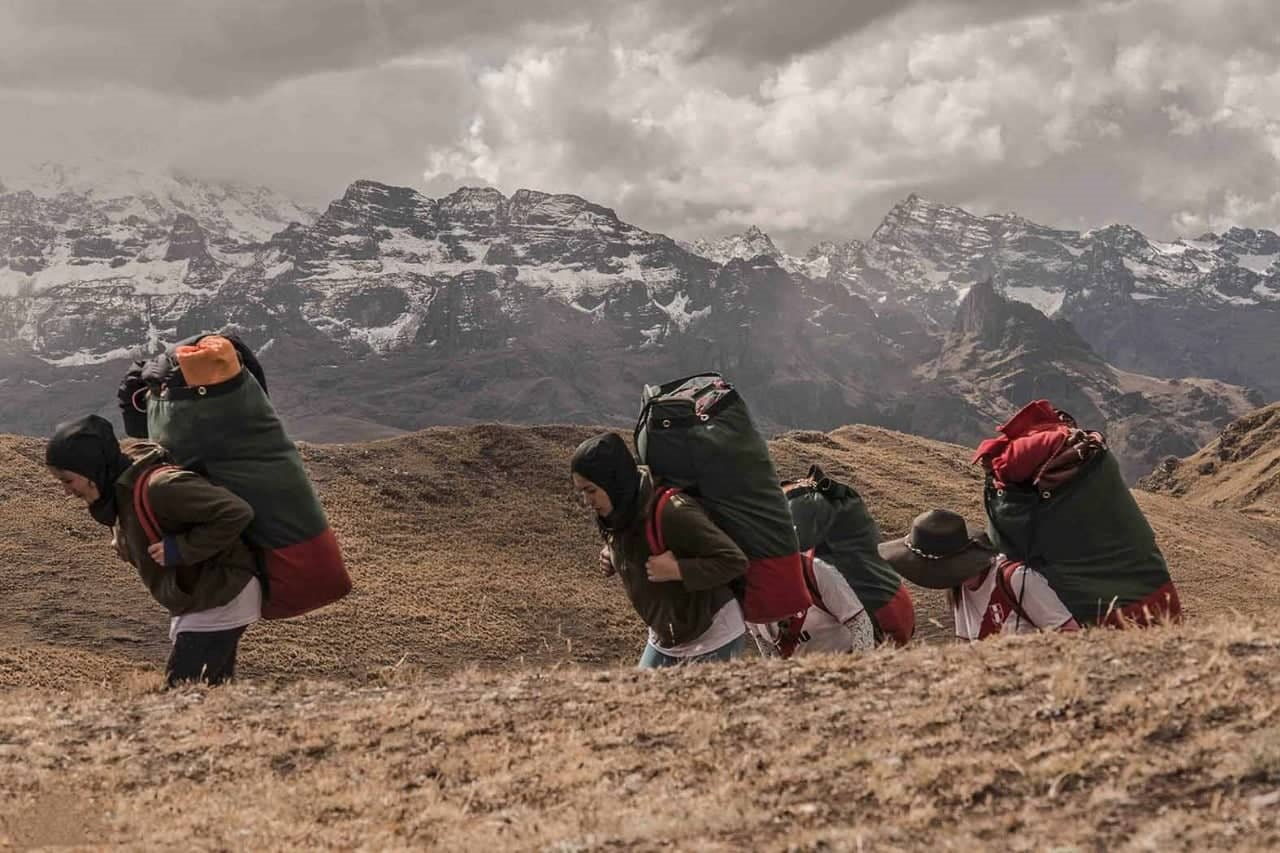 Fenale porters carrying their packs on on the Inca Trail