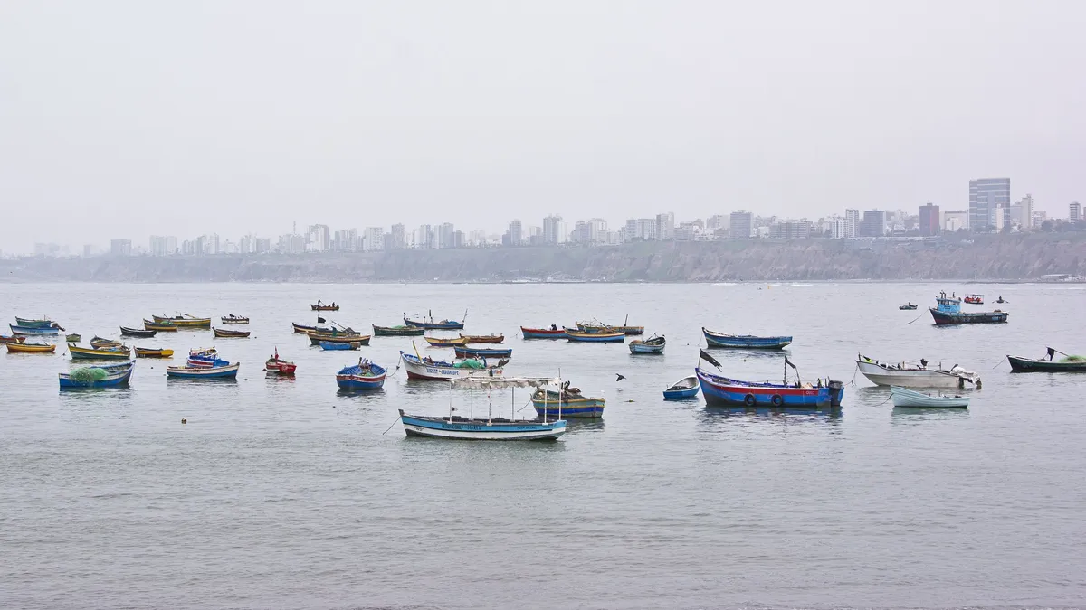 Fishing boats at Muelle de Pescadores (Fisherman's Wharf), Chorrillos district, Lima. Photo by Tomas Sobek.