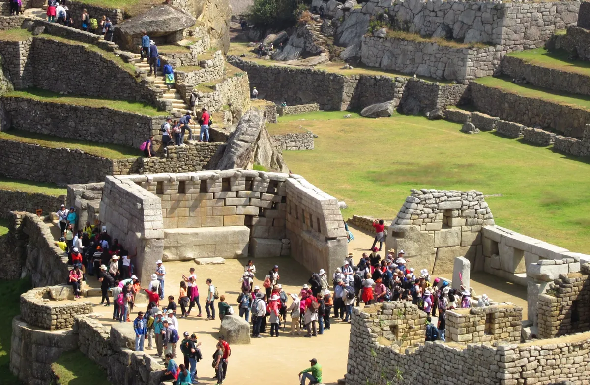 Crowds of visitors among the ruins of Machu Picchu, Peru. Photo by Tony Dunnell.