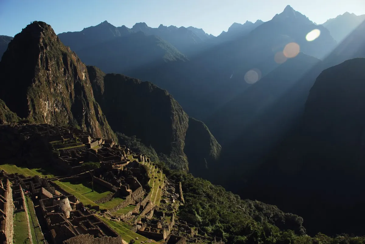 The sun rises up above Machu Picchu. Photo by Tinou Bao, flickr.com.