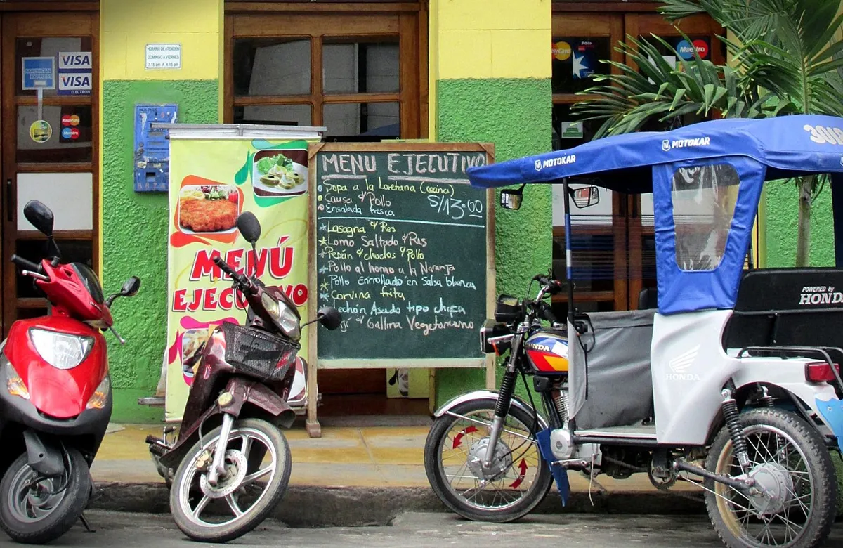 A Peruvian menú blackboard outside a restaurant in Iquitos. Photo by Tony Dunnell.