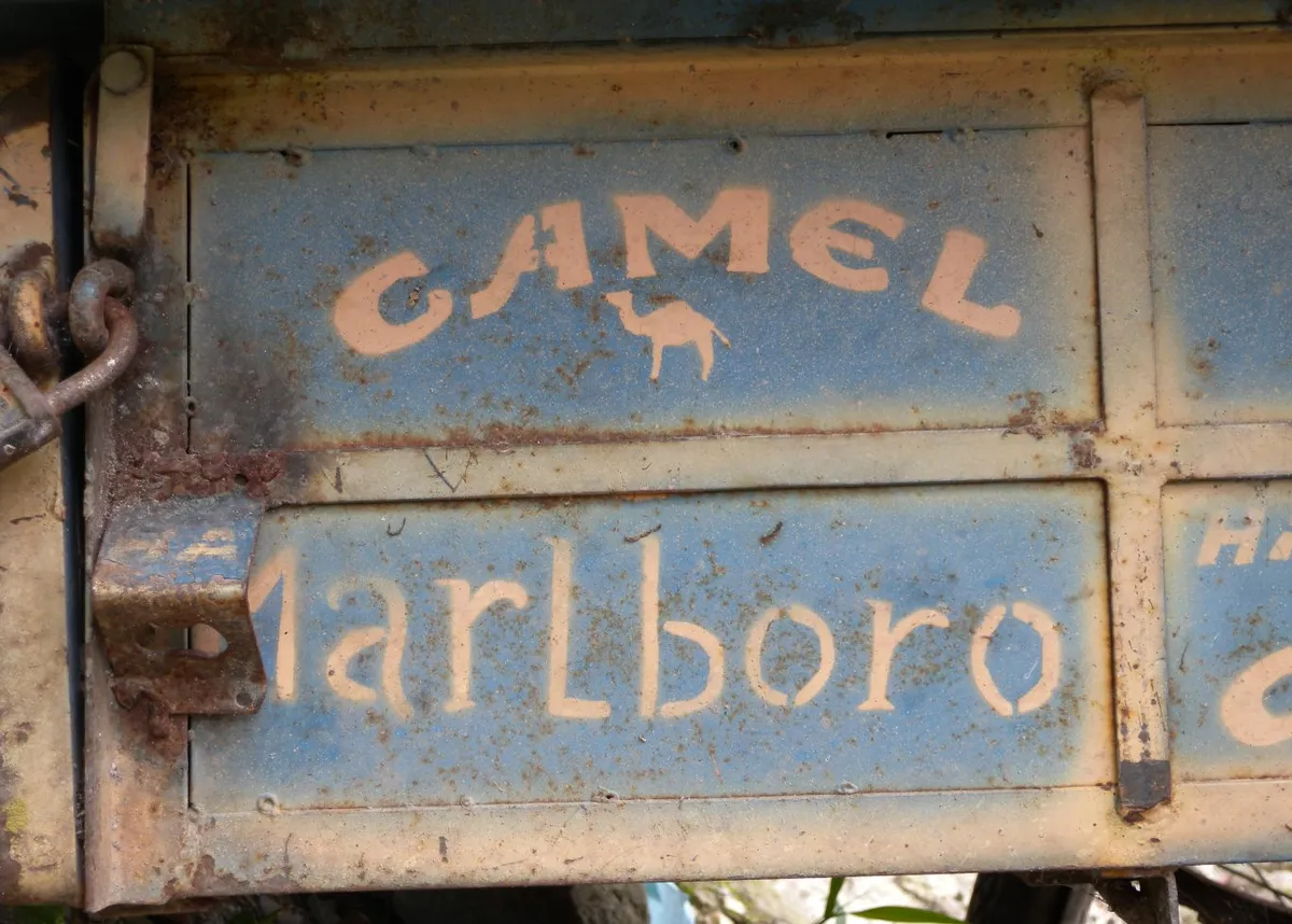 An old cigarette sign in Aguas Calientes, Peru. Photo by Ryan McFarland, flickr.com.